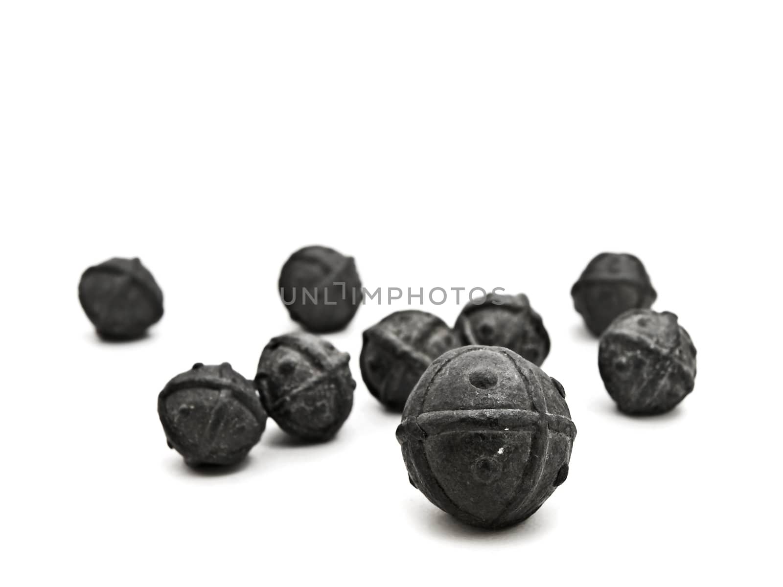 scattered lead shot for hunting against white background