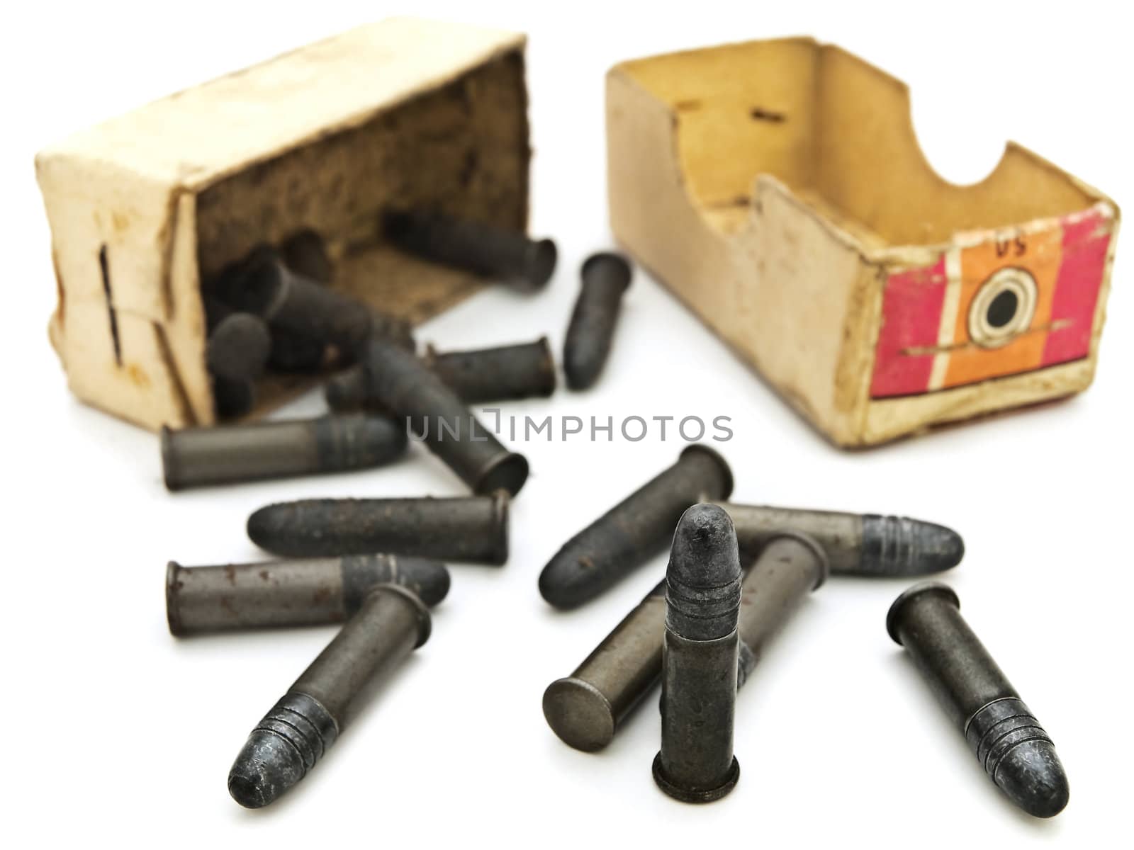 Photo of old  scattered from box metal bullets against white background