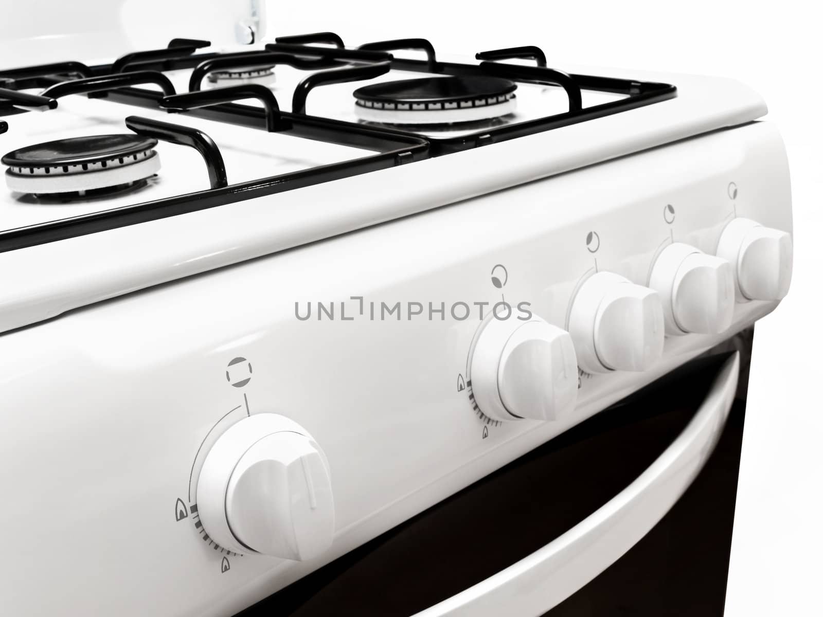 lateral view on part of white gas cooker over the white background
