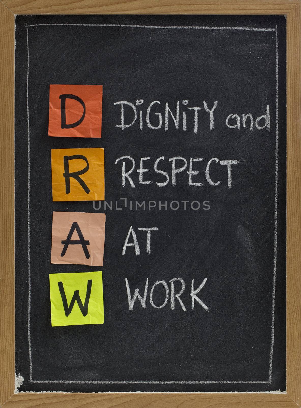 DRAW (dignity and respect at work) - workplace culture acronym, white chalk handwriting, colorful sticky notes on blackboard
