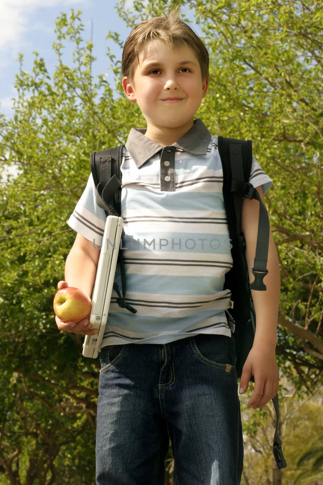 Pupil walking to school on a sunny day.  
