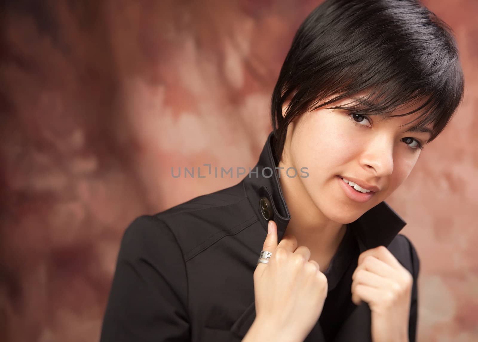 Multiethnic Girl Poses for a Studio Portrait.