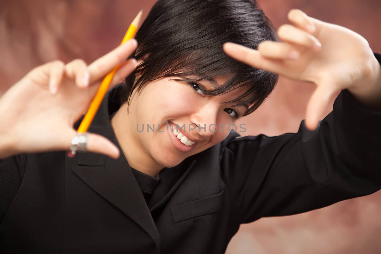 Pretty Multiethnic Girl Poses for Her Portrait Making a Frame with Hands.