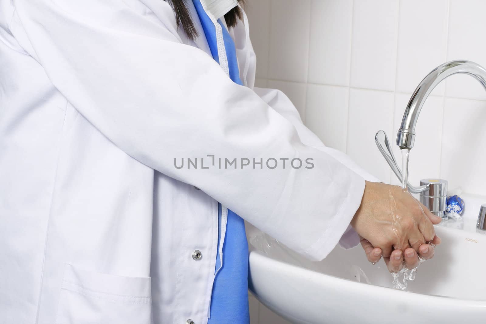 Doctor or a nurse or surgeon washing hands