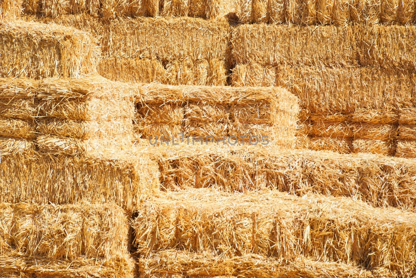 Horizontal Stack of Hay Bailes by pixelsnap