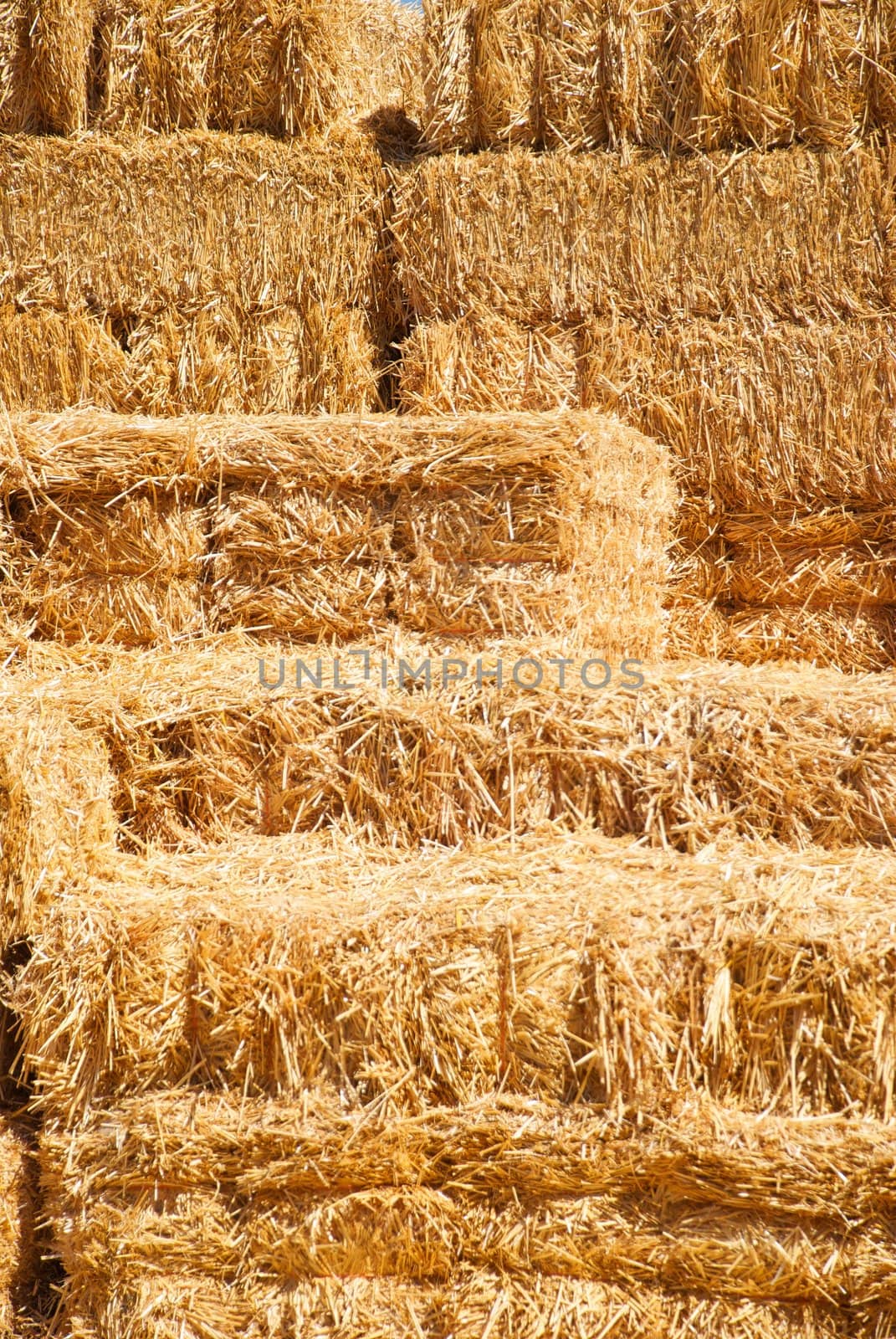 A stack of scattered hay bailes