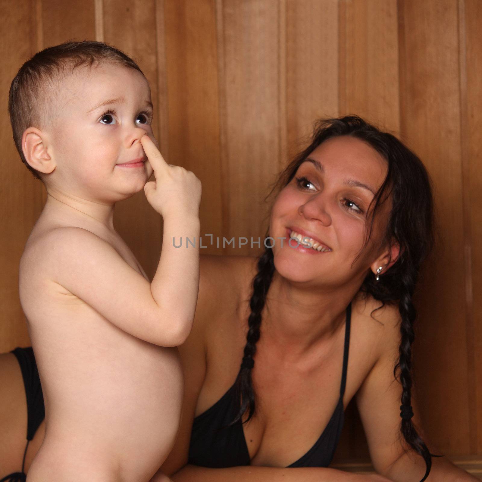 Mum with the small son are heated in a sauna
