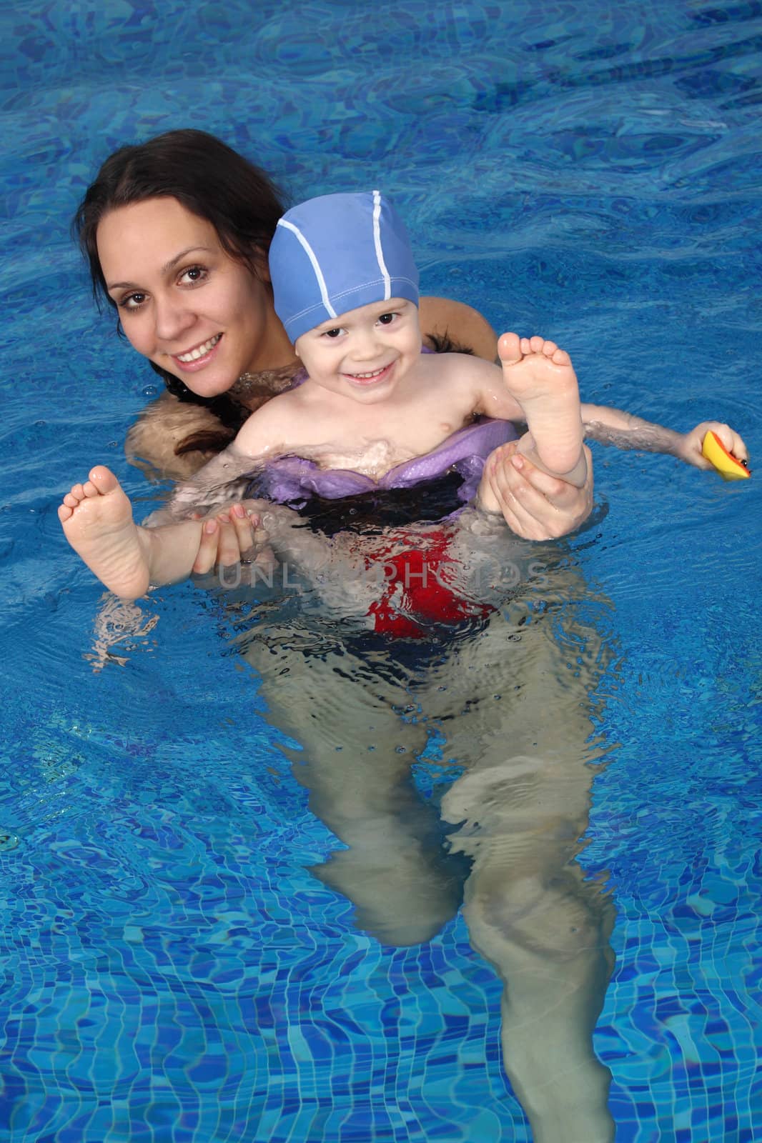 Mum with the son bathe in pool