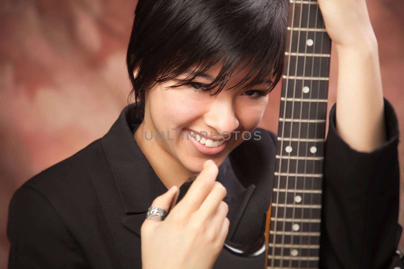 Multiethnic Girl Poses with Her Electric Guitar.