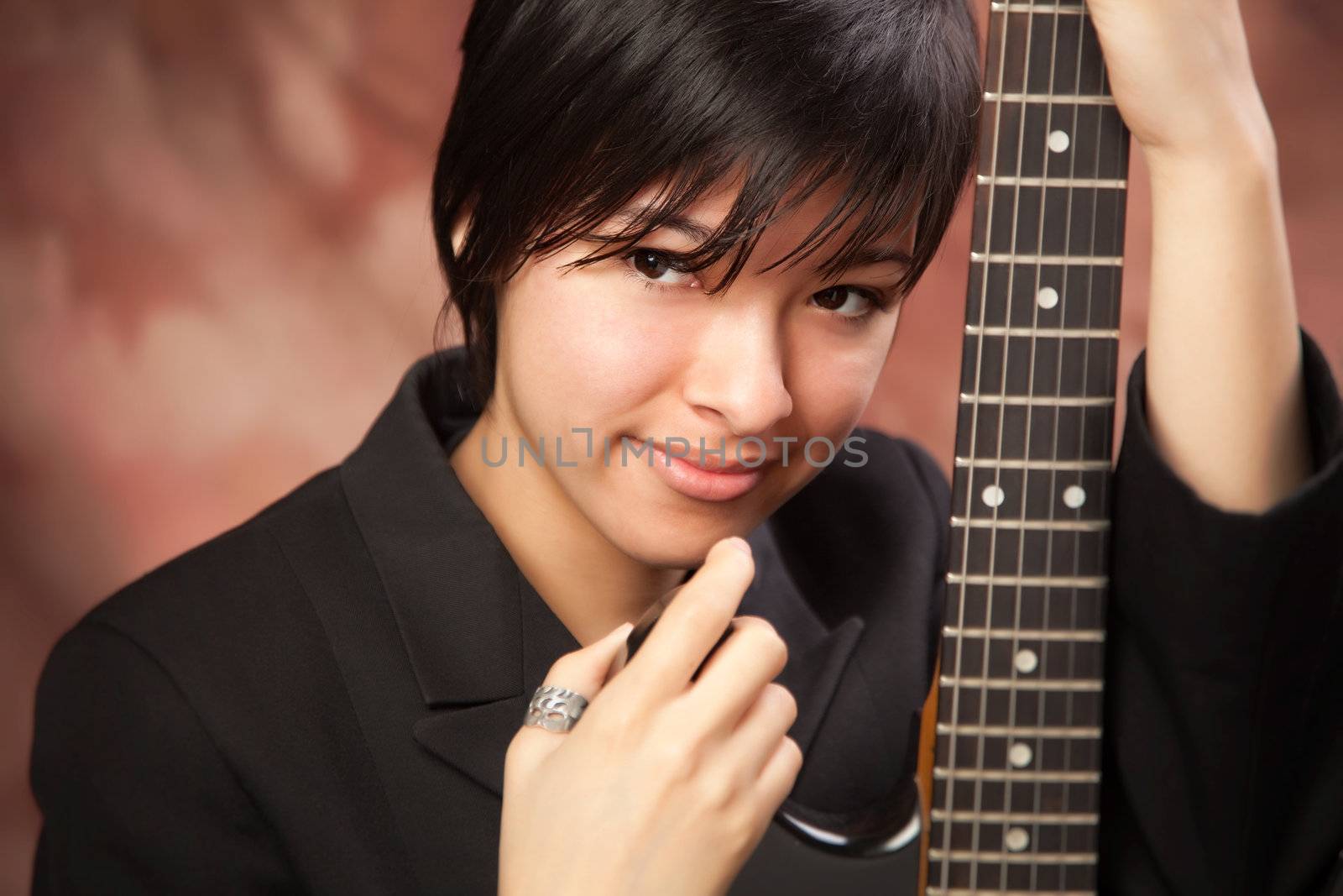 Multiethnic Girl Poses with Electric Guitar by Feverpitched