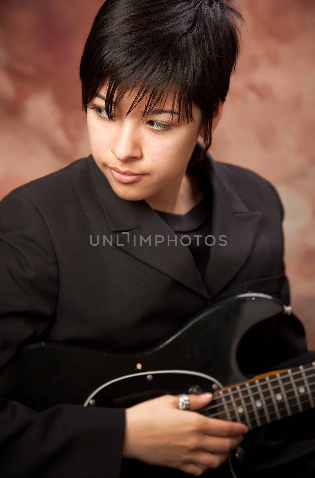 Multiethnic Girl Poses with Electric Guitar by Feverpitched