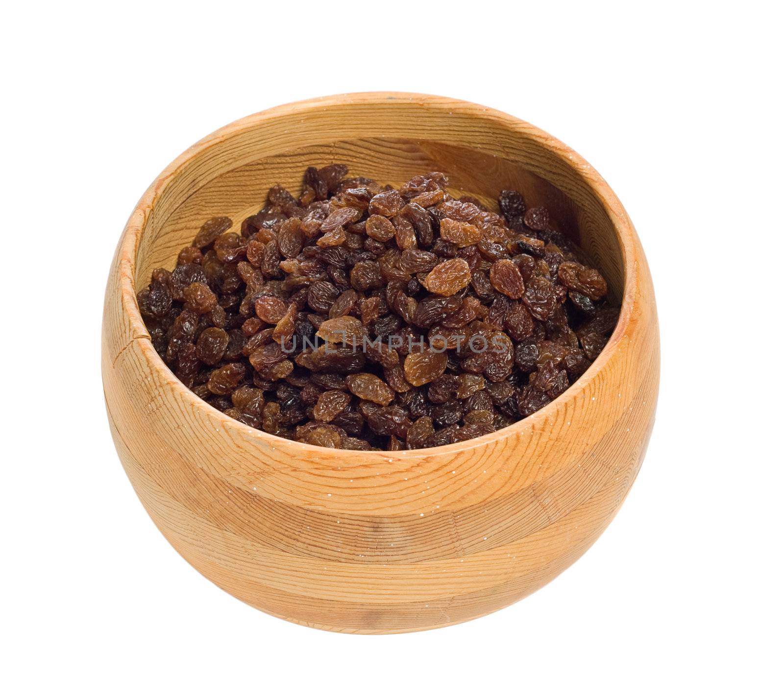 A wooden bowl filled with raisins, isolated against a white background