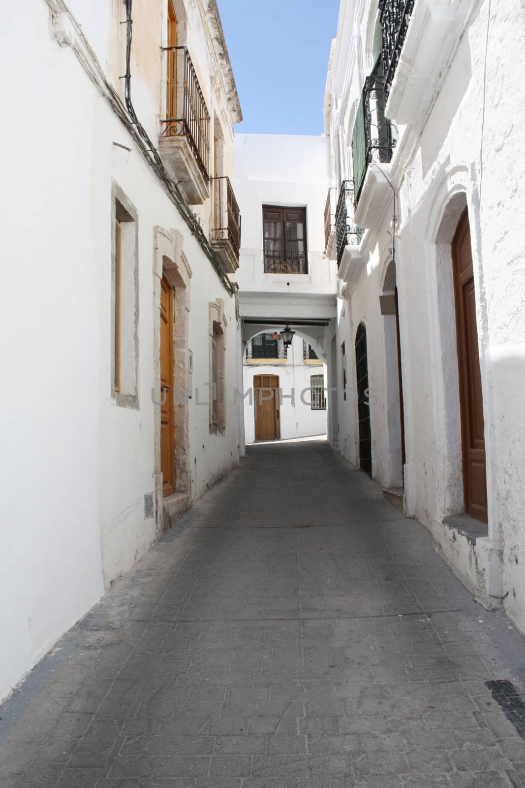 A typical Andalusian street with whitewashed houses. Nijar, a village in the province of Almeria (Spain).