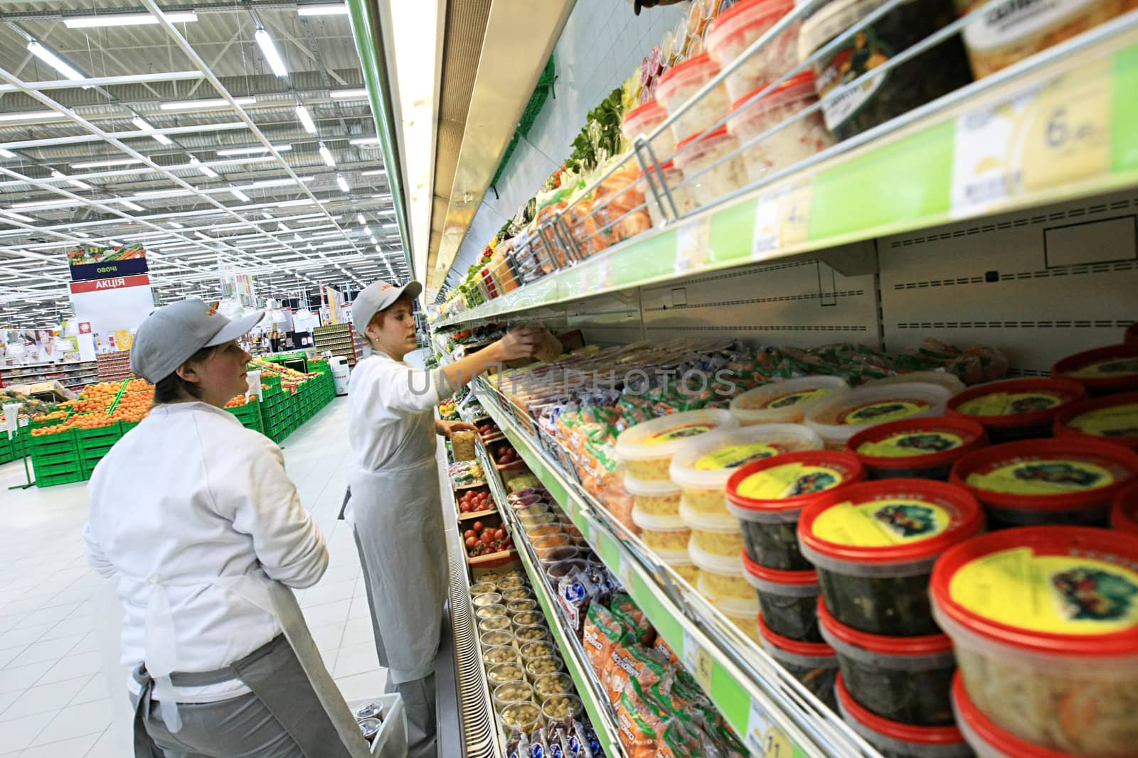  KYIV, UKRAINE - NOVEMBER 13: Worker in supermarket during preparation for the opening of the first store of OK supermarket network on November 13, 2007 in Kyiv, Ukraine.