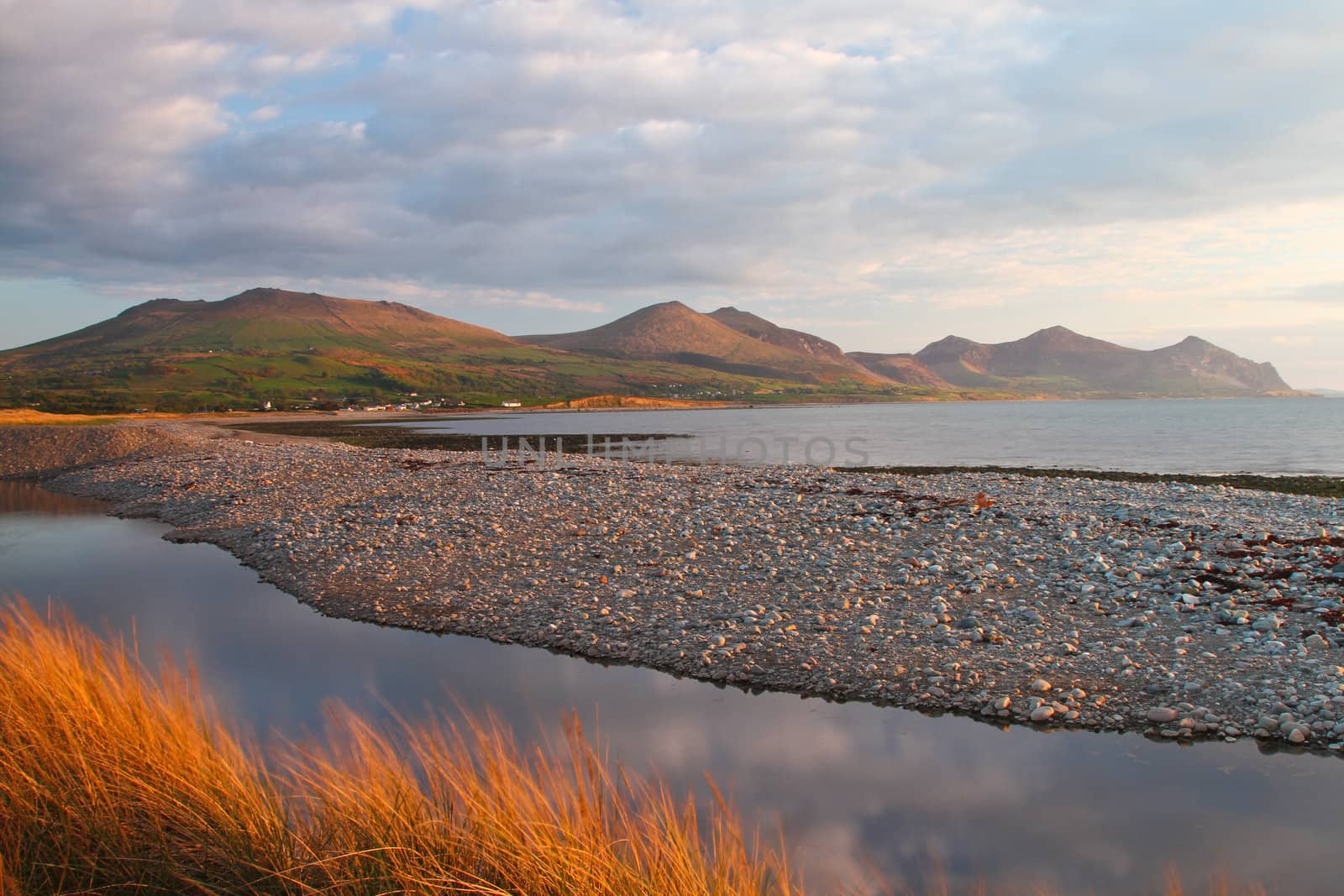 Landscape with mountains and sea in the evening sun.