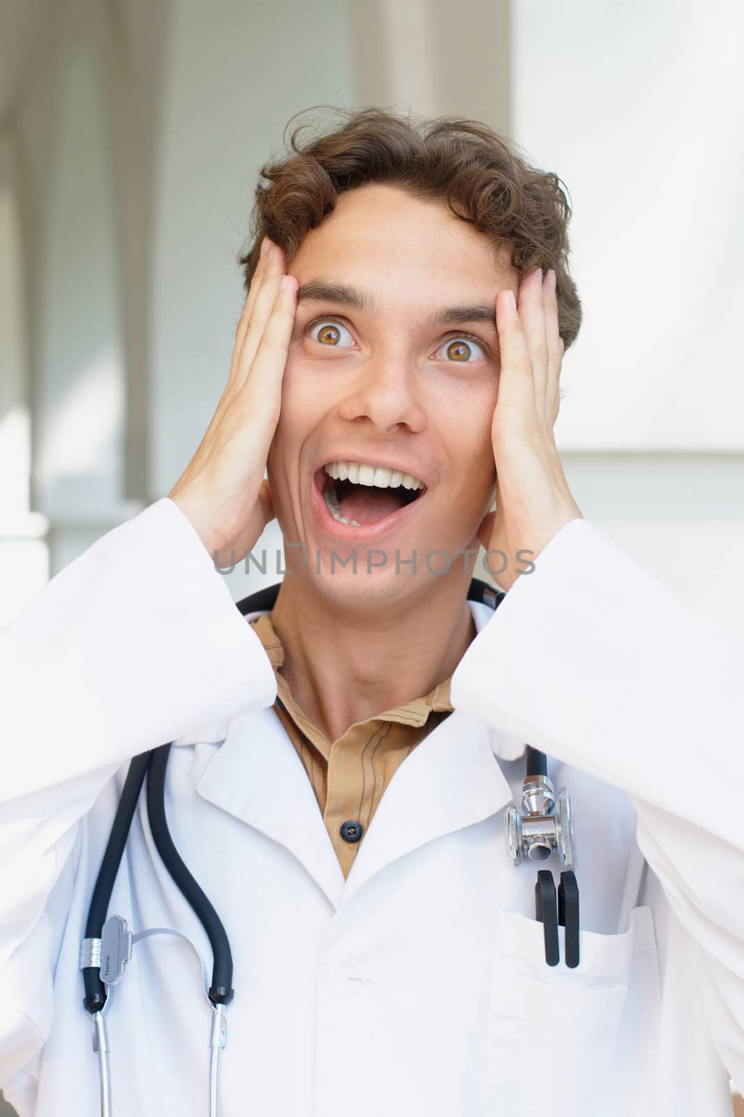 Close-up portrait of a screaming young doctor