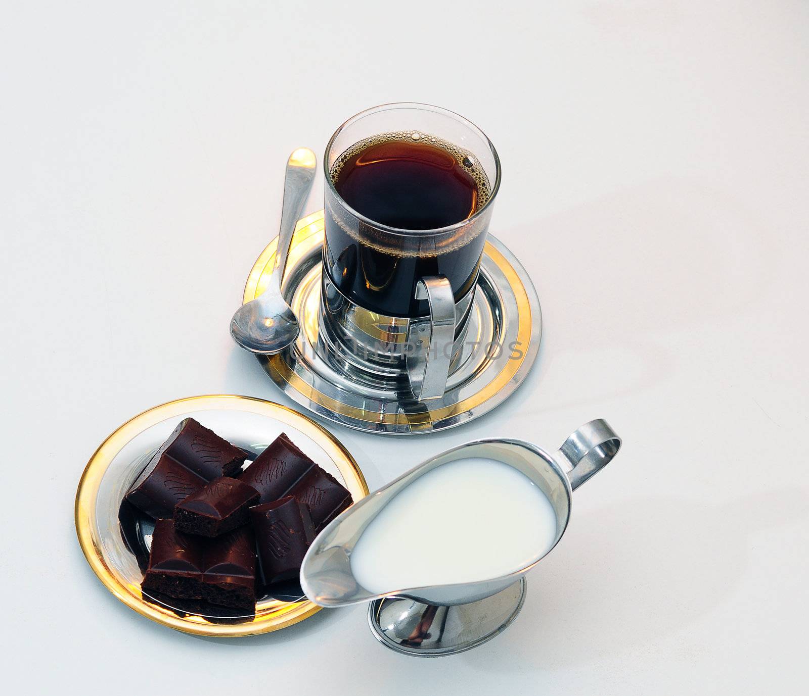 Coffee, chocolate and Cream-jug for cream with fresh cream .