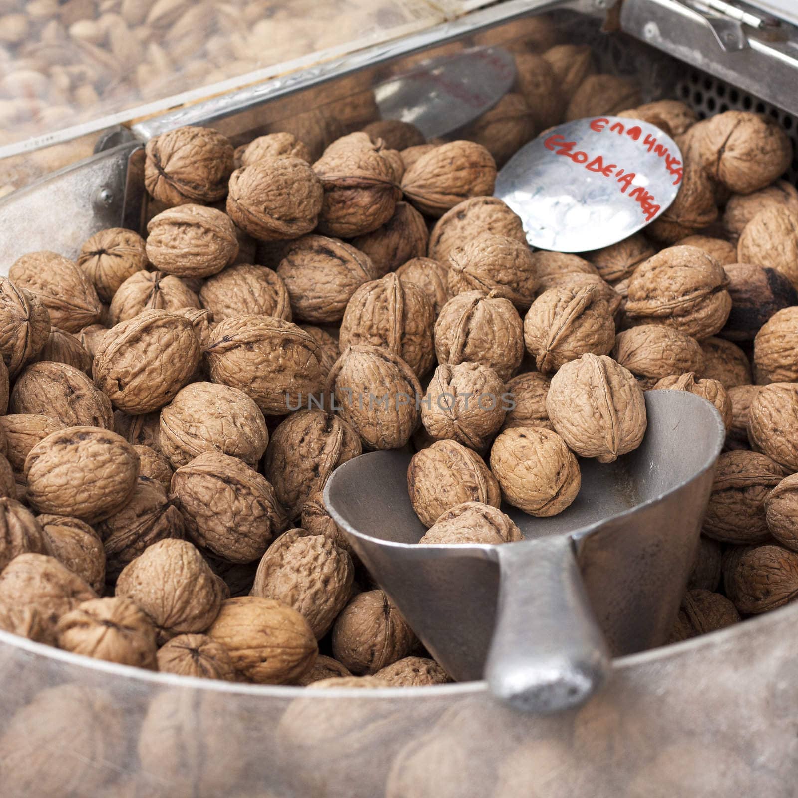 Greek walnuts on display at a Greek market stall.