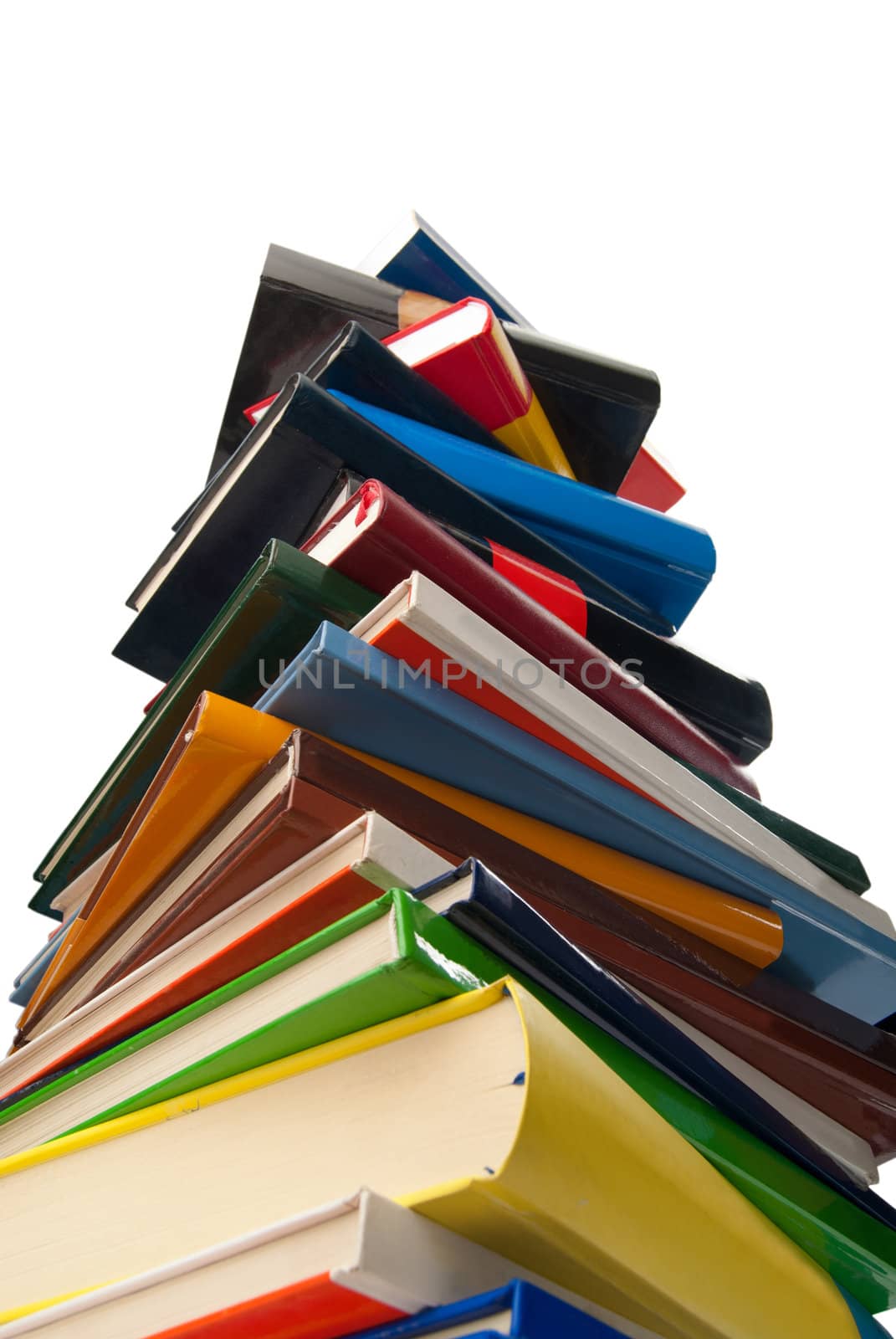 Books towering one over the other isolated on white