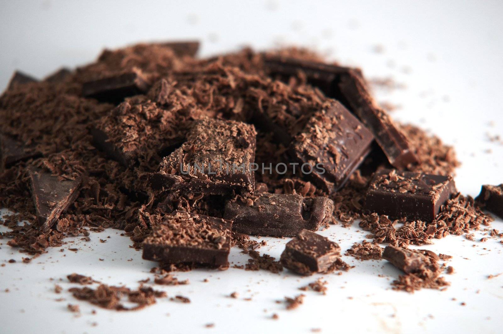 Heap of crumbled chocolate chunks .