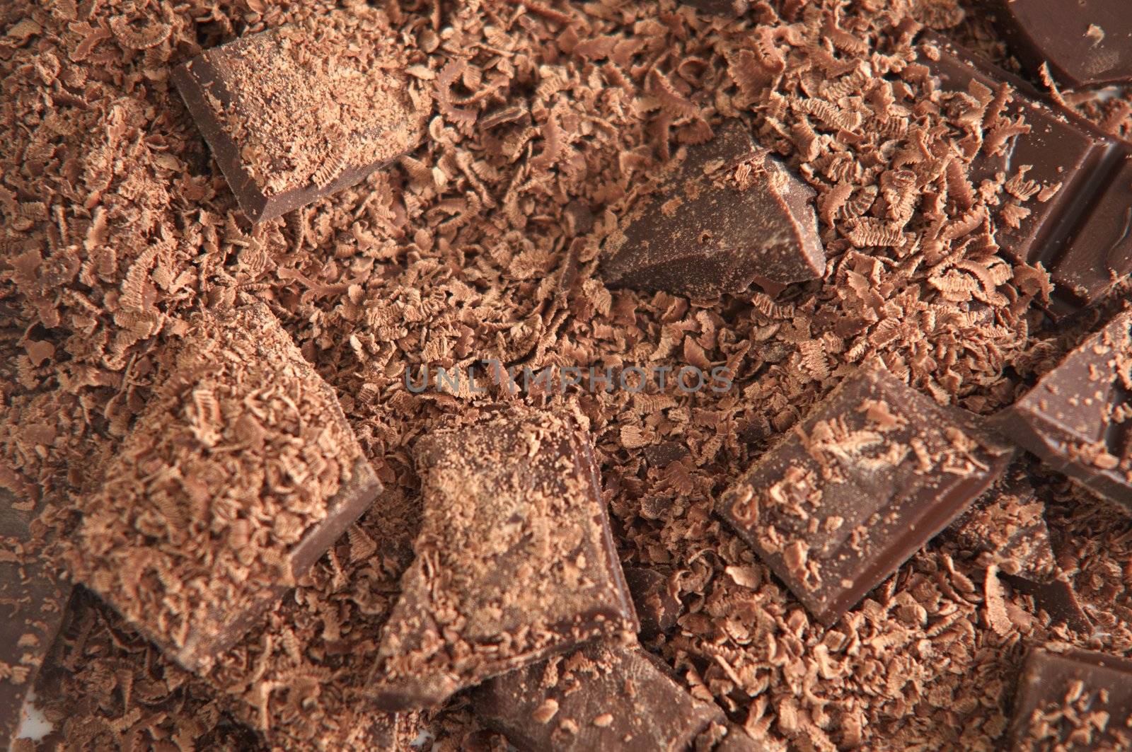 Heap of crumbled chocolate chunks .