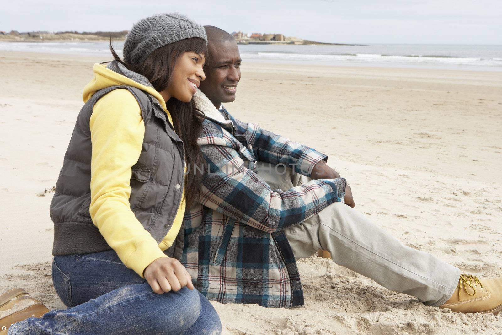 Romantic Young Couple On Winter Beach by omg_images