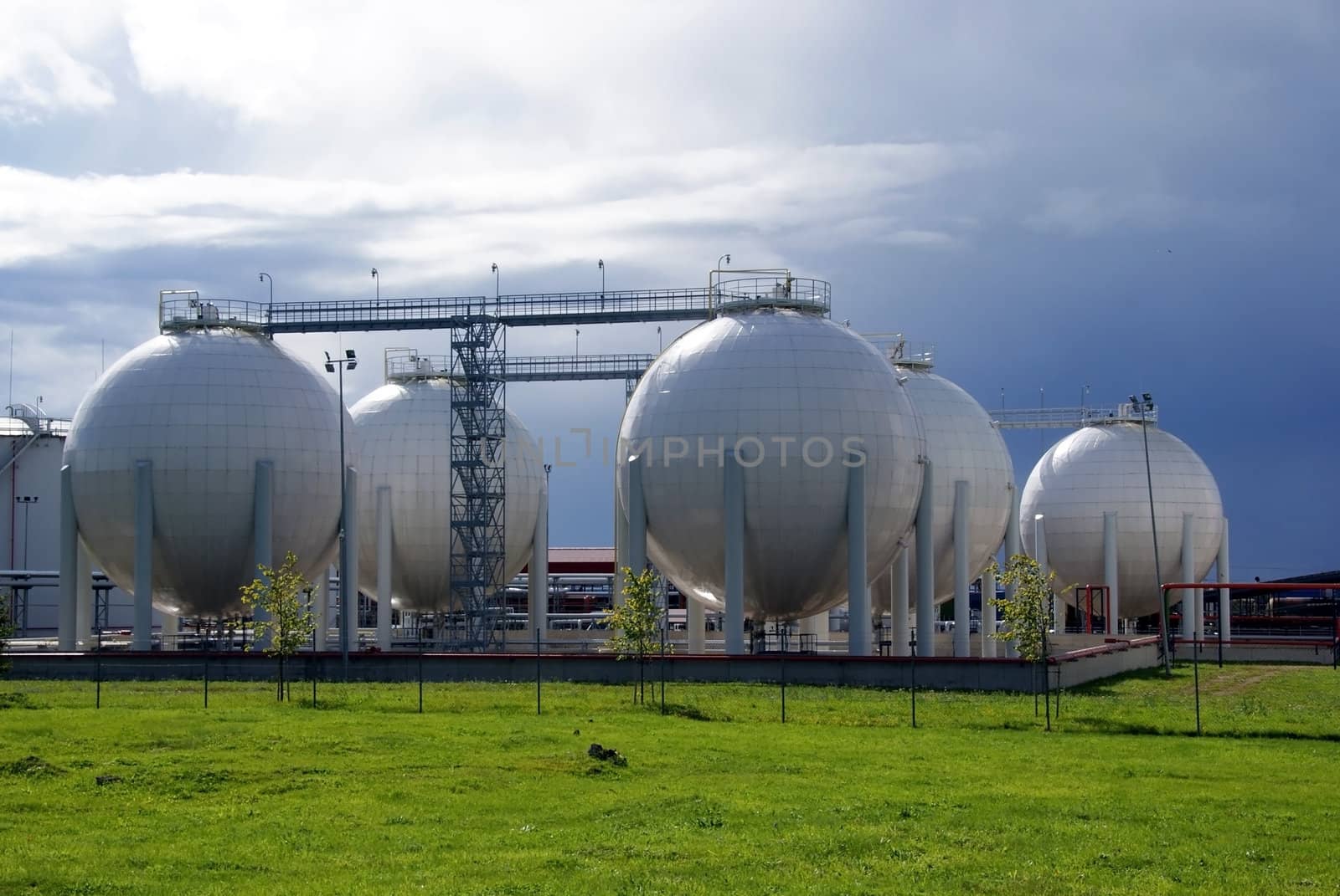 Gas tanks on a background of the dark sky