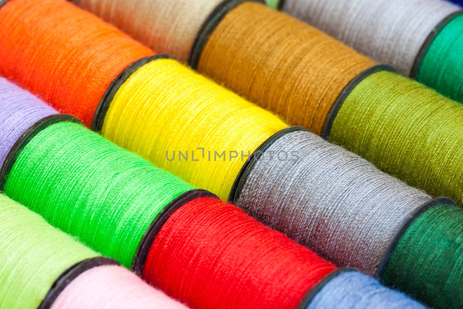 Close-up of colorful spools of thread