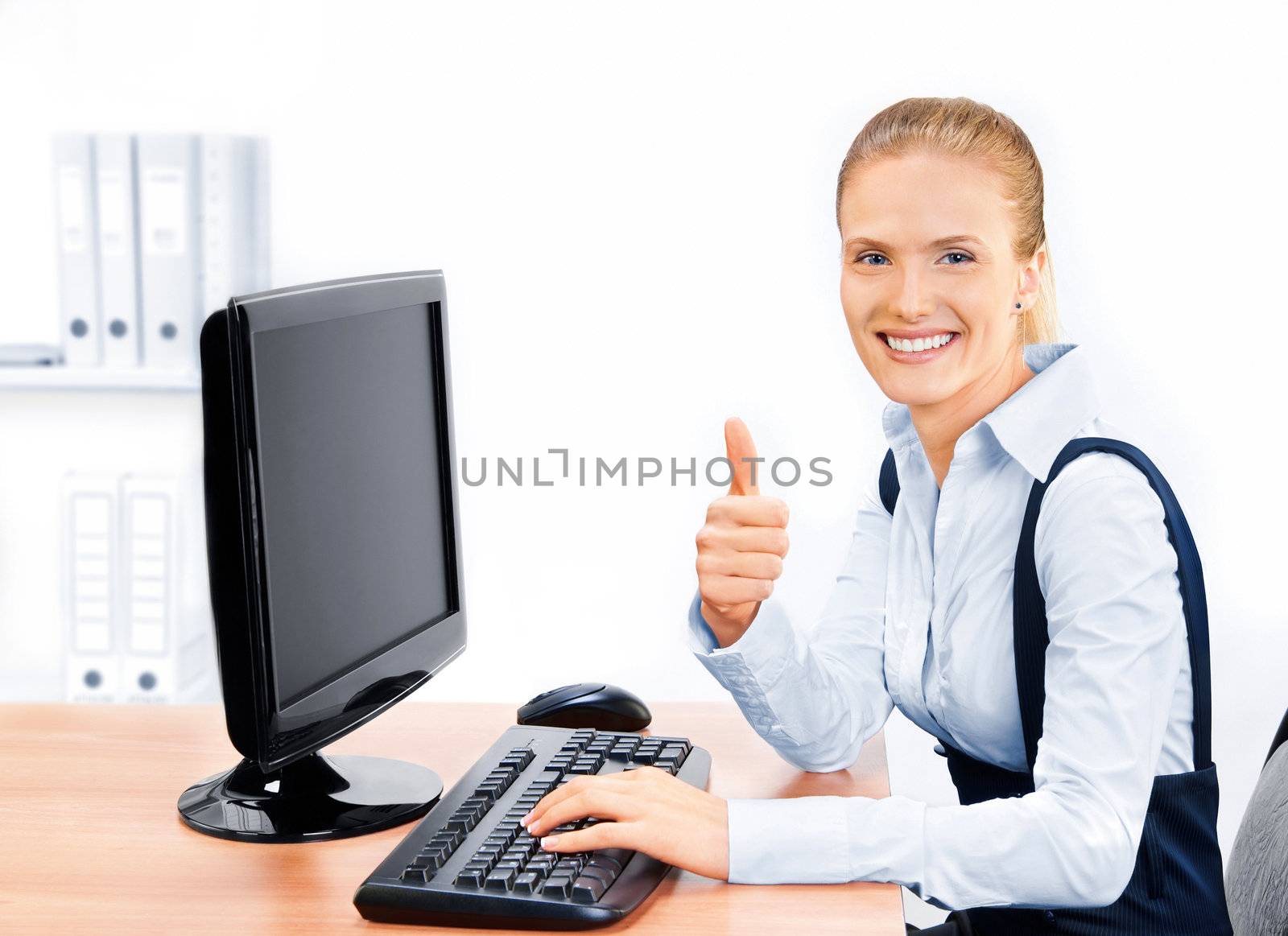 Businesswoman with thumbs up. Screen has a clipping path.