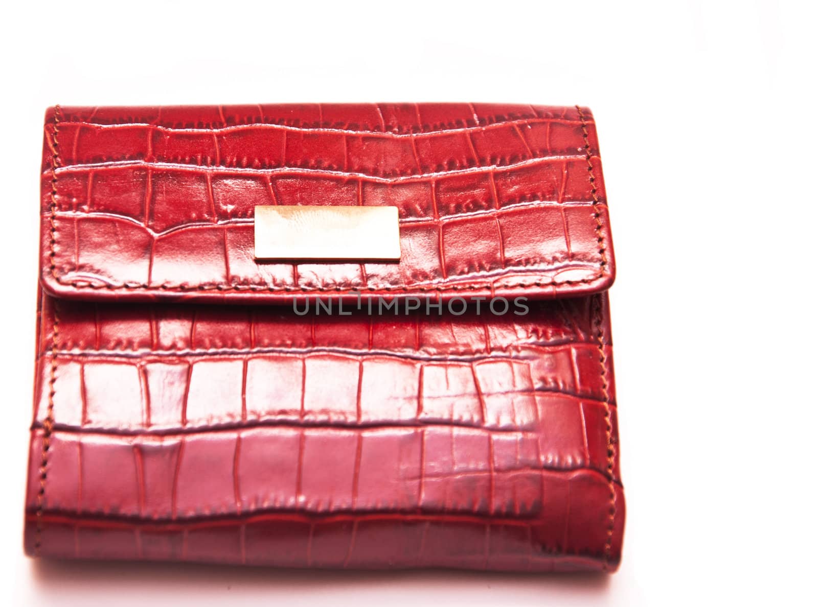 closed female red purse on white background