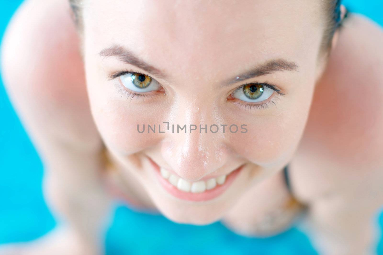 Smiling girl at the swimming pool by rosspetukhov