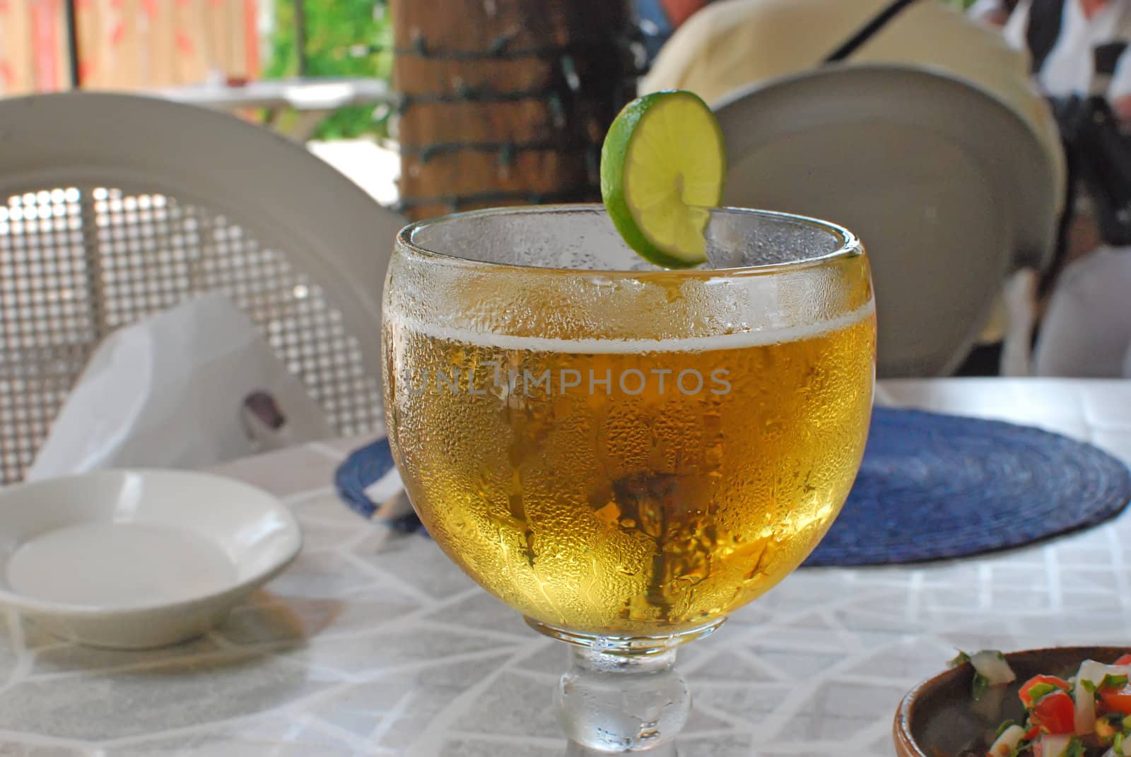 closeup of a goblet of beer with a twist of lime