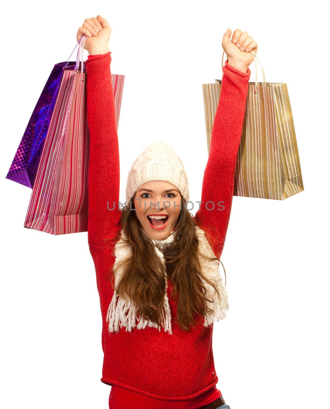 Beautiful young woman happy to finish christmas shopping by Jaykayl