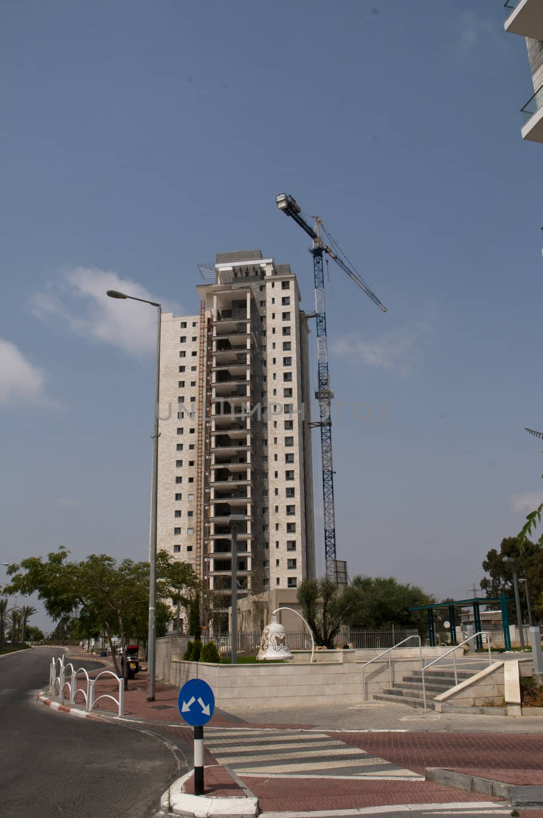 Construction of new apartment building  in progress incomplete construction.