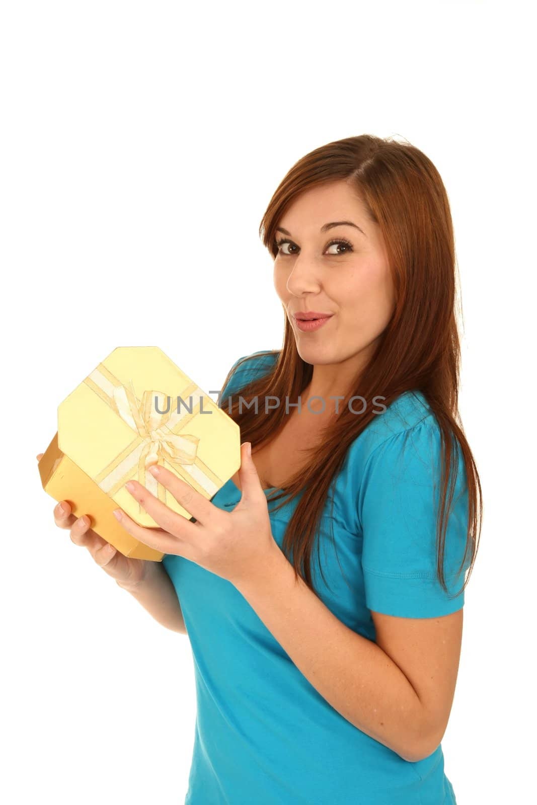 Excited beautiful brunette woman about to open a surprise present