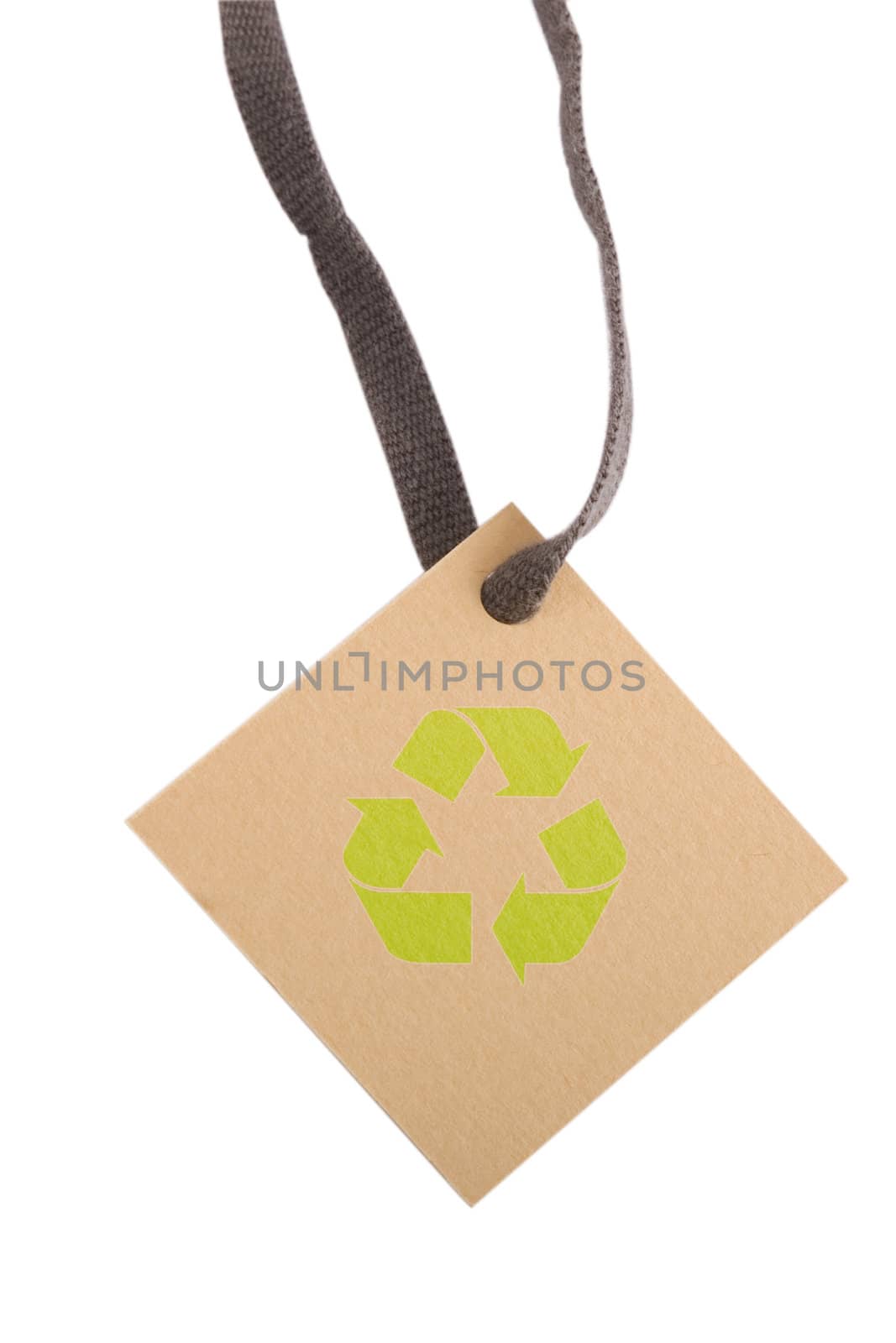 tan tag and green recycling sign on white background 