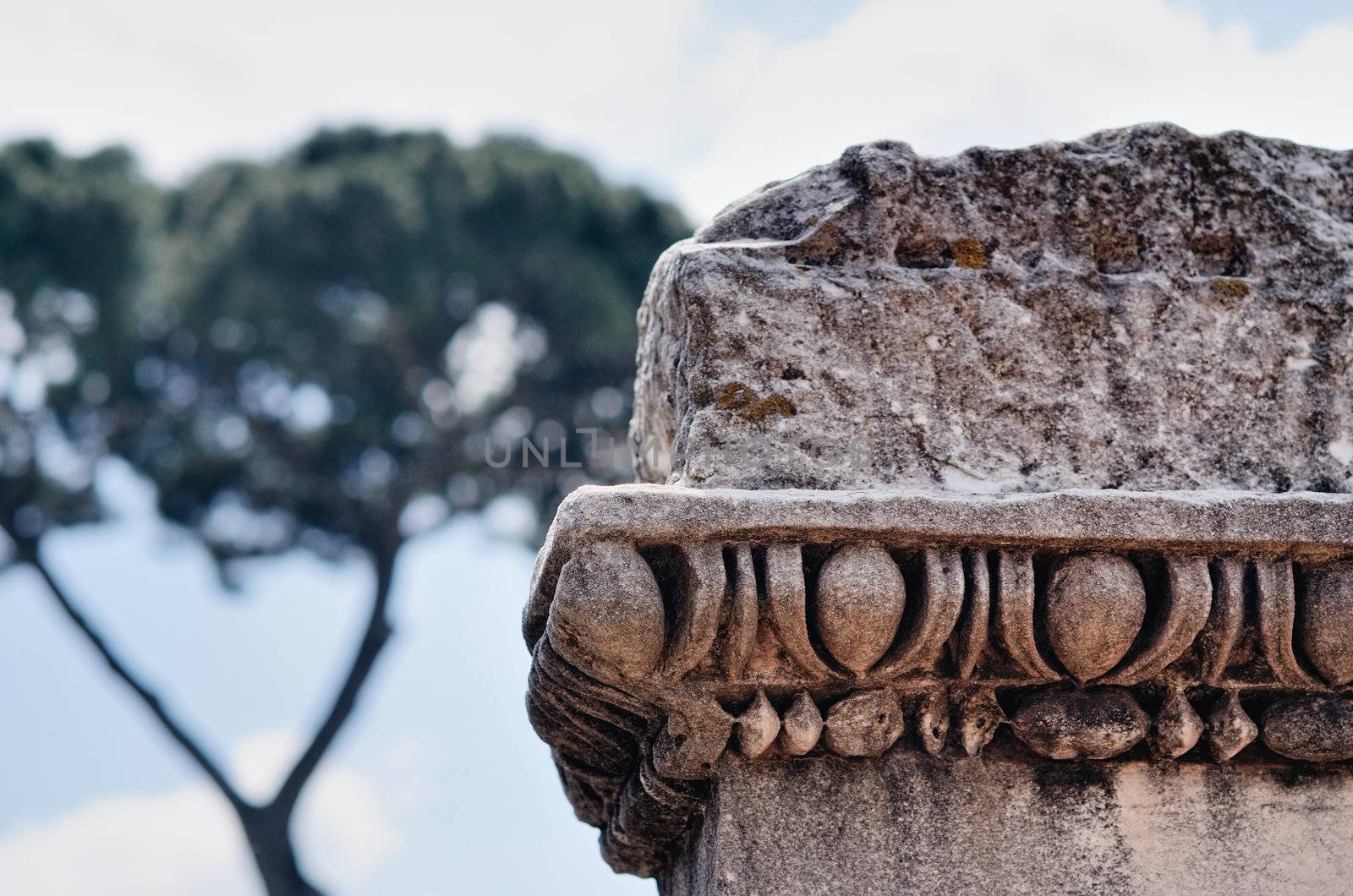 Ancient marble column against a sky. Rome, Italy