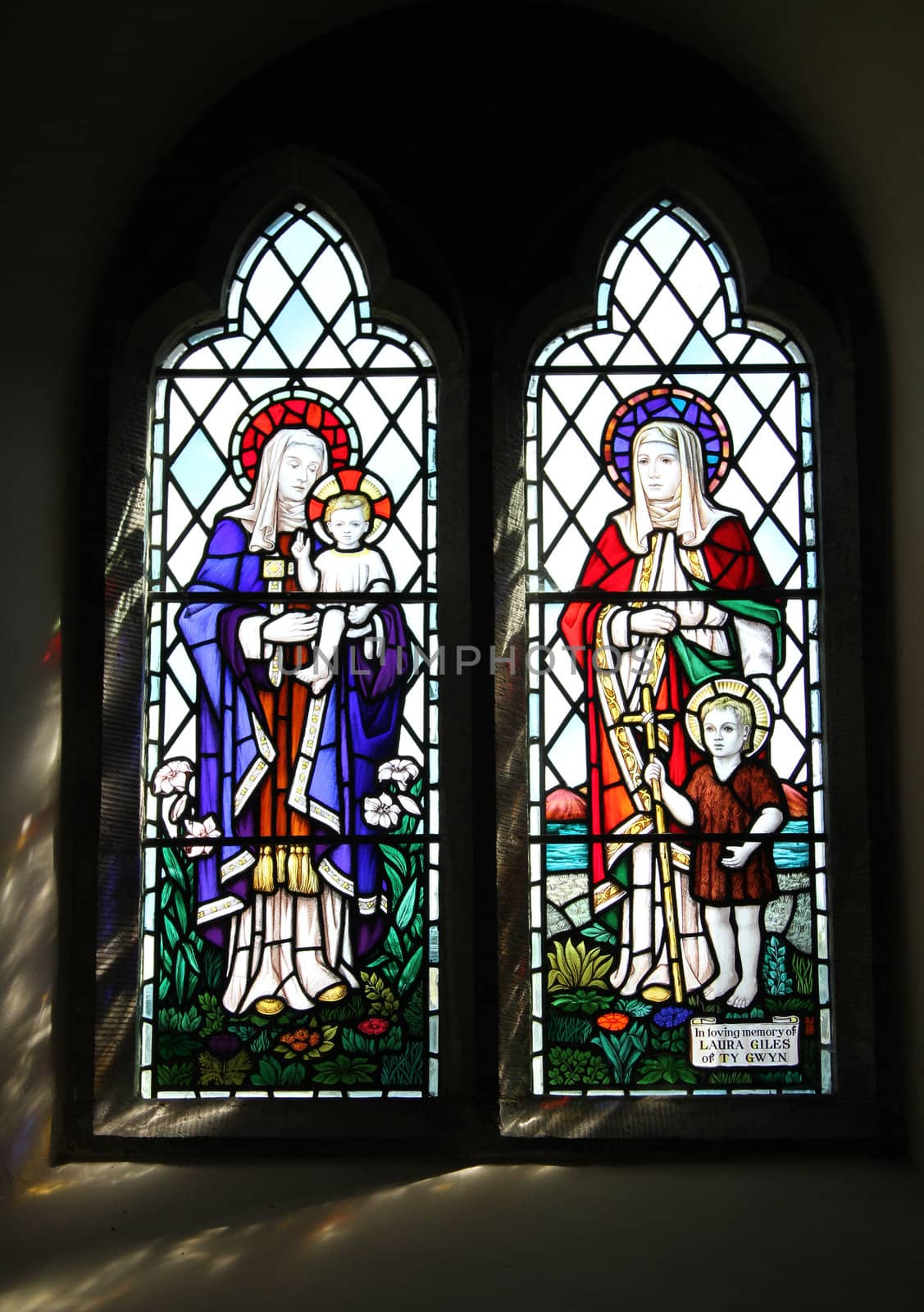 Historic stained glass window, christian theme.