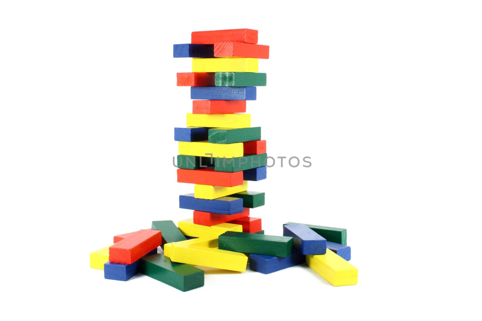 Colored wood bricks a child game, isolated on white