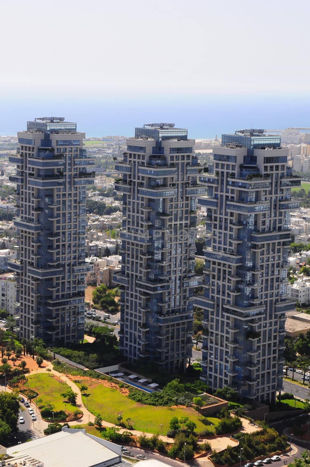 Exterior of modern high rise office buildings with glass windows and blue sky background. Tel-Aviv .