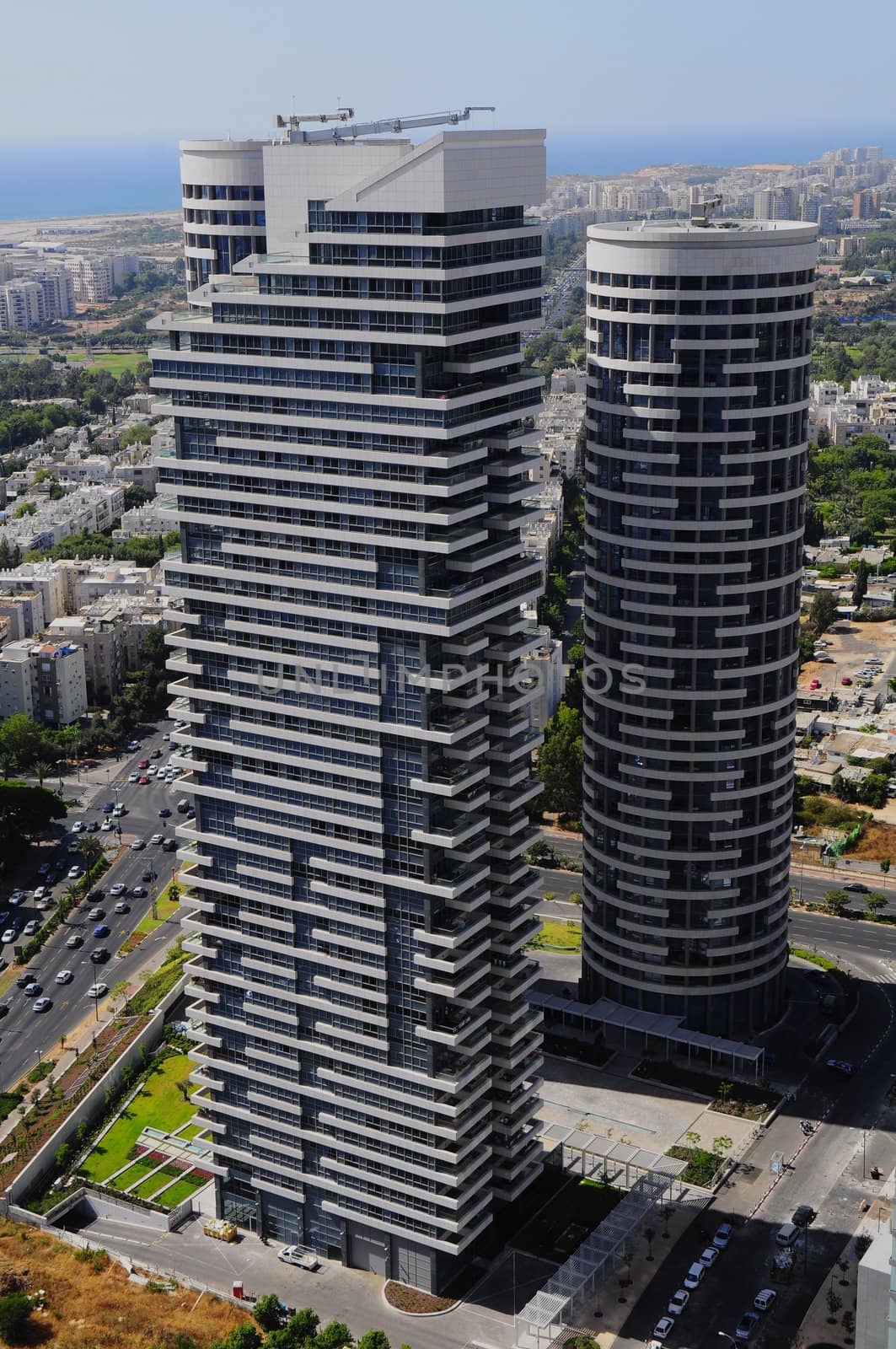 Exterior of modern high rise office buildings with glass windows and blue sky background. Tel-Aviv .