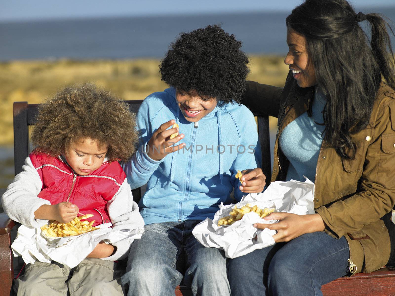 Happy family having picnic by omg_images