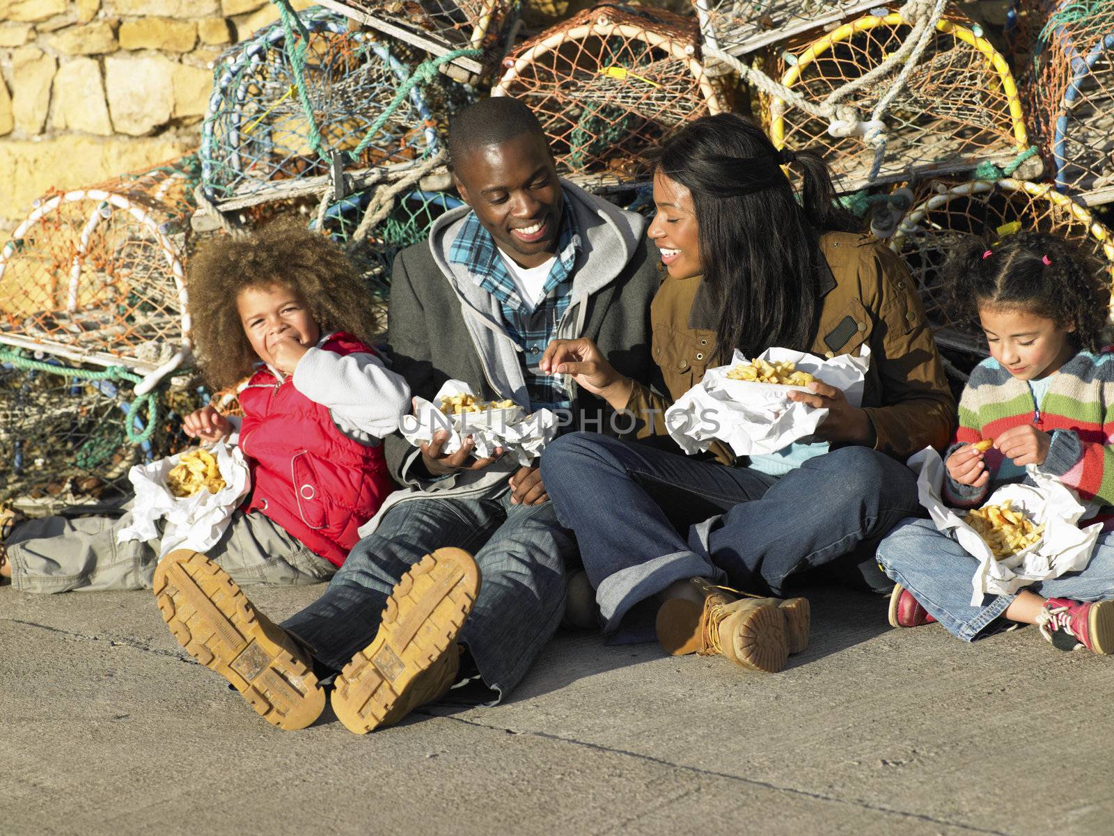 Happy family having picnic by omg_images