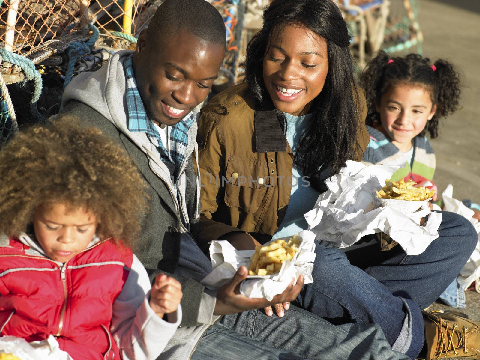 Happy family having picnic by omg_images