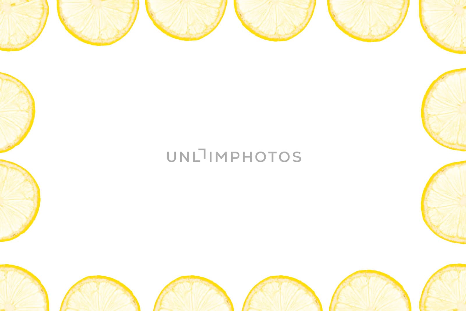 frame made of yellow lemon slices on white background