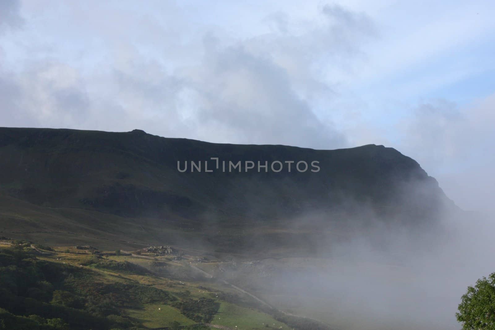 Mist rolling up a valley by chrisga