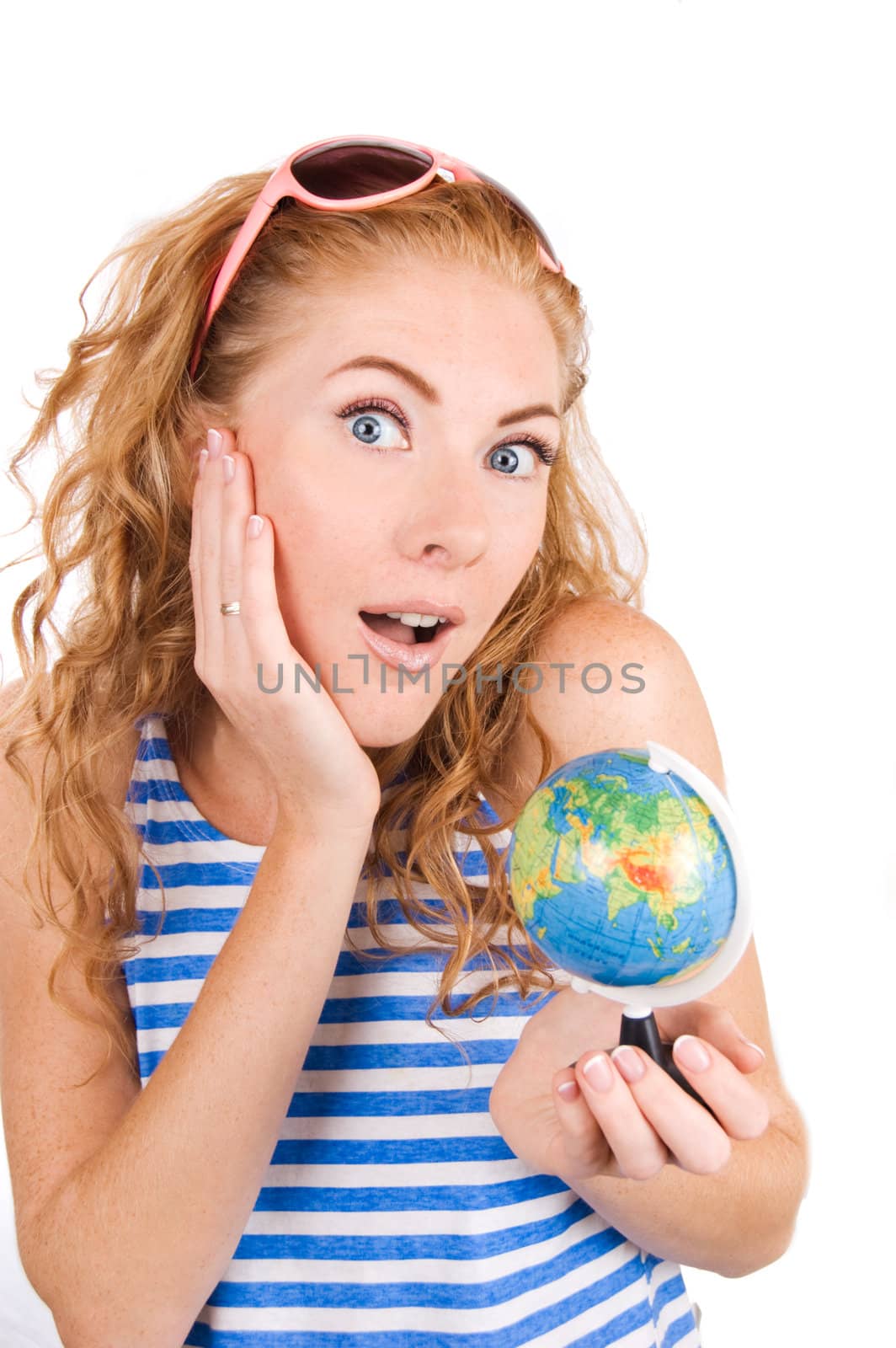 Amazed woman in striped vest and with globe over white