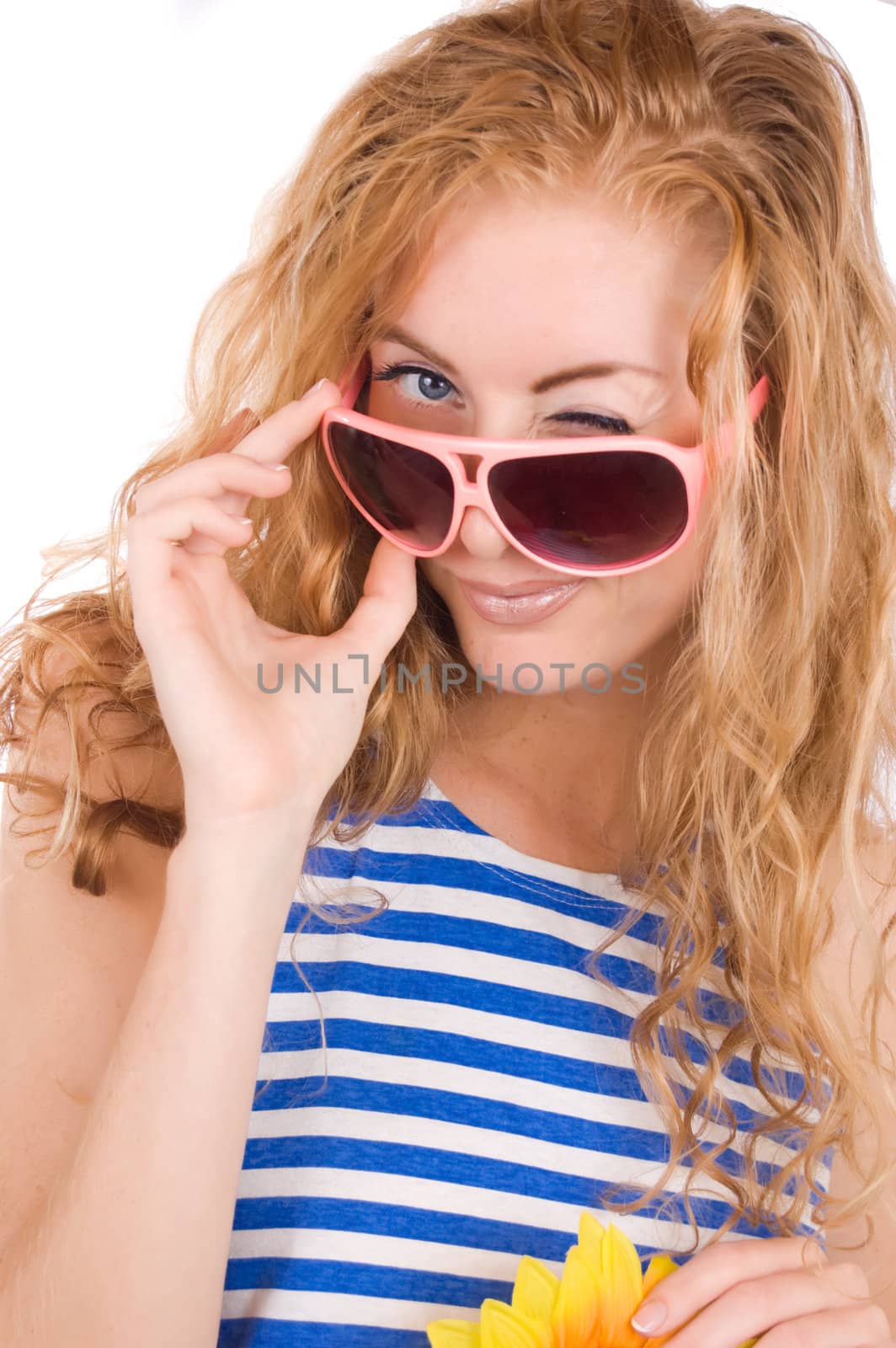 Woman in striped vest and pink glasses winking over white