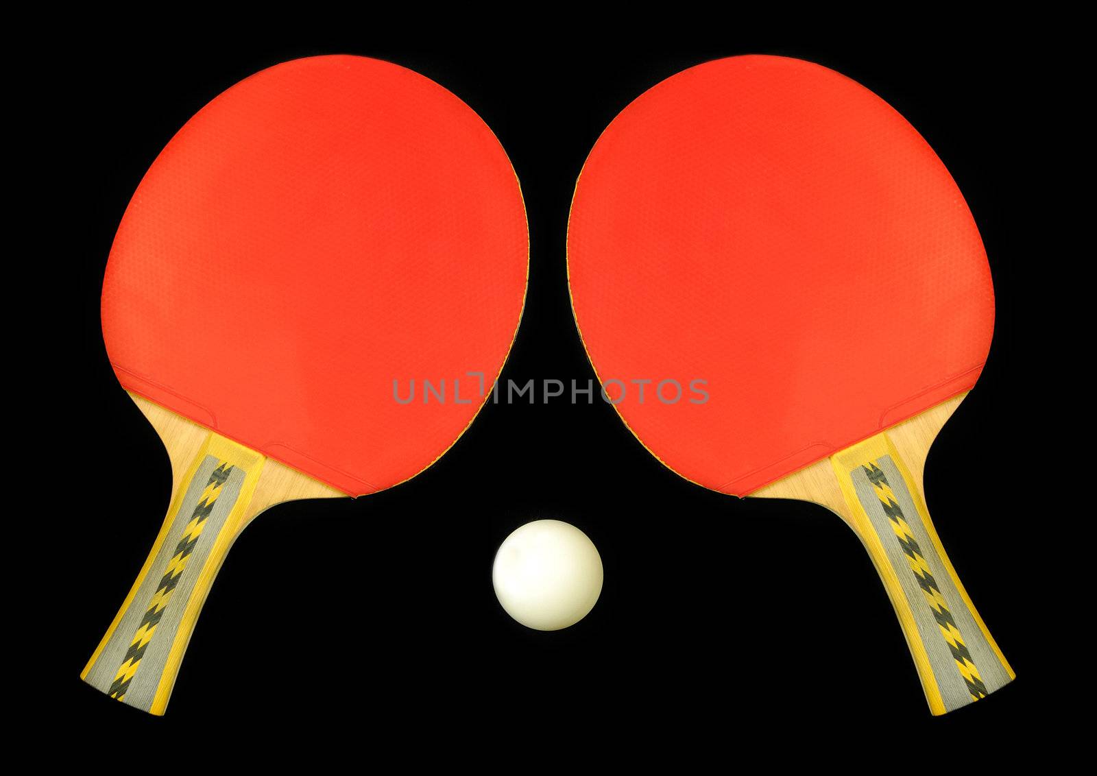 Table tennis double paddle and ball over black