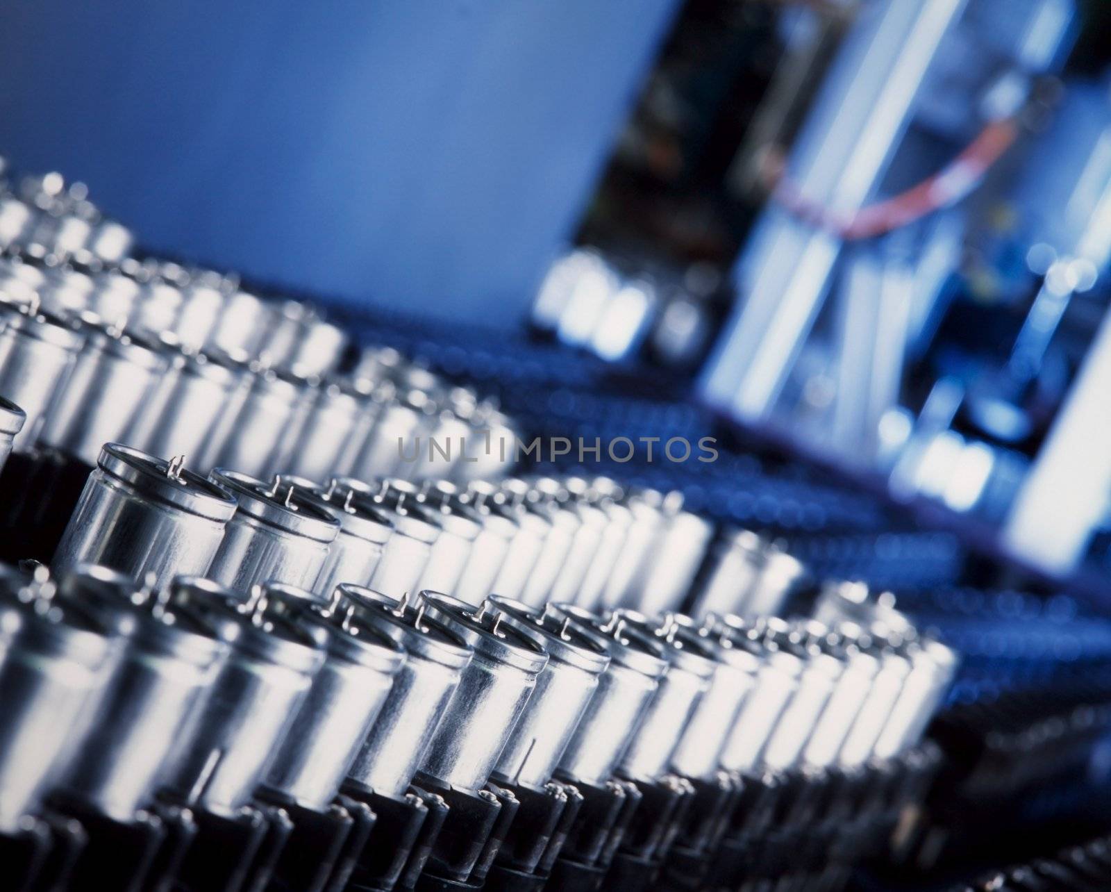 close up of a capacitor production machine